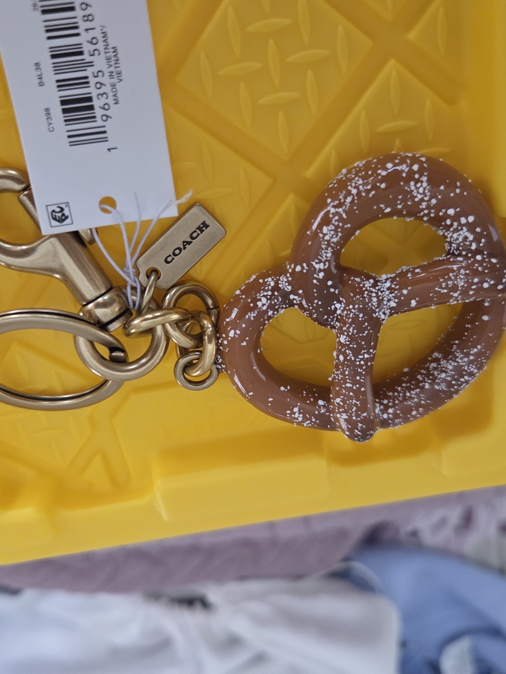 COACH Brown Pretzel Keychain with Gold Hardware